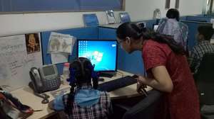 Young people sharing the workspace of volunteers