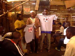 Youths in Ndeeba Receiving Be A Man T shirts
