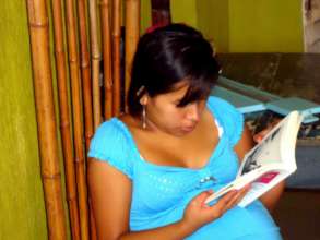 Expectant Mother Reads About Nutrition