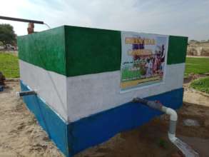 water well with green farm