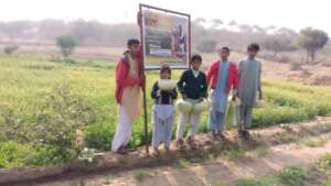 Children with vegetables in Green Farms by CHCS