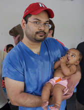 Dr. Aziz and a child he performed cleft surgery on