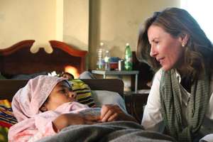 Kate Grant visiting a recovering fistula patient.