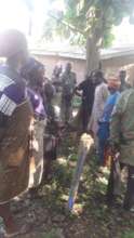 villagers standing  at the point marked
