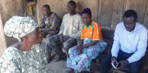 Our team and villagers at the village  meeting