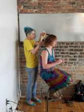 Kayla getting her hair styled