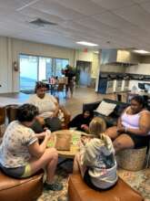 HALO girls & staff playing Apples to Apples