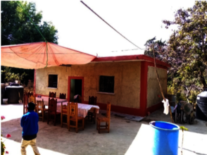 Ambrosia and her new rebuilt house (Mamalhuazuca)