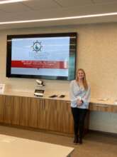 Rachael presenting at a conference in Chicago, IL