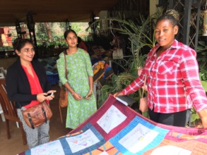 Constance shows her quilt at ICPD25 in Nairobi