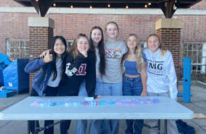 Ruby (center) and her team sell Clean Girl soap