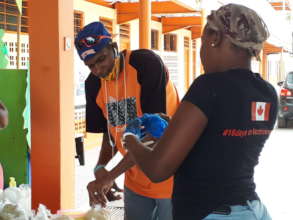 Volunteers measuring non perishable food.