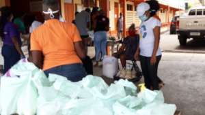 Packaging food parcels bought with grant from GG