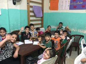 Students greet us at the PWHO school in Shatila