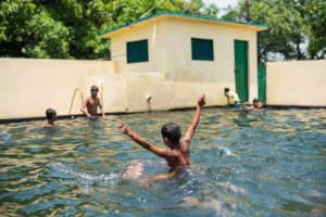 The boys having a swim in our pool