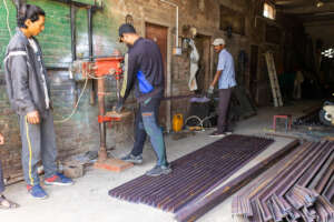 Posts being fabricated for our fencing project.