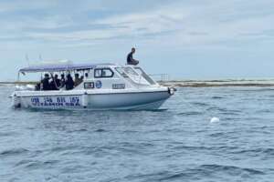 A boat using the mooring buoy after installation