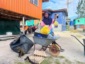 A local islander helping with waste segregation