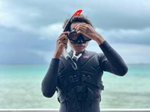 A participant practicing a safety briefing