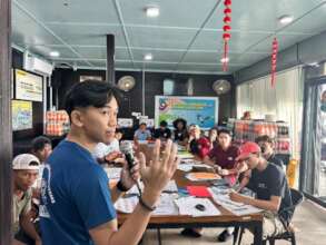 A trainer briefing participants on marine ecology