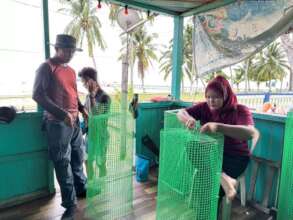 Local villagers preparing collection bins