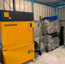 Baler machine and compacted plastic bottles
