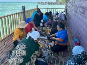 Selakan community working together