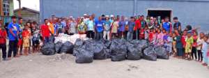 Some of the villagers with the rubbish collected