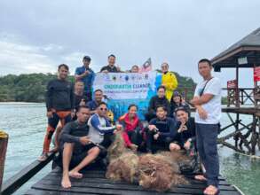 The team with some of the retrieved ghost nets