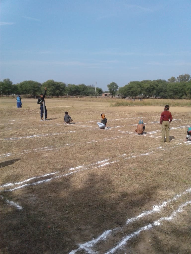 Children marking the boundary lines for Kho-Kho