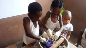 Girls on sculptures through sand casting Project