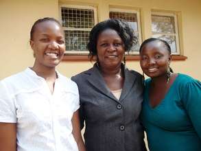 Headteacher Florence with Mercy and Rosabella