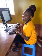 A student enjoying learning computer skills