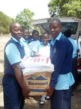 Students receive the paper for recycling