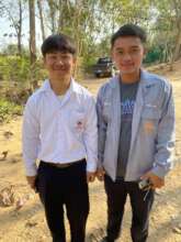 Songa(R) helps Pokpong (L) prep for his internship