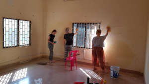 Scrubbing and repairing cracks then painting