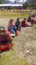 Social distance line to receive the bags of food.