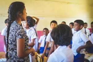 A confident main diploma student teaching children