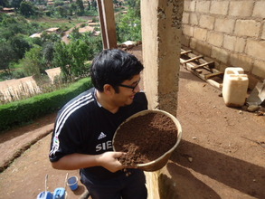 Our UK Volunteer carrying sand up for cementing