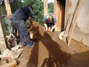 Two Volunteers measuring sand