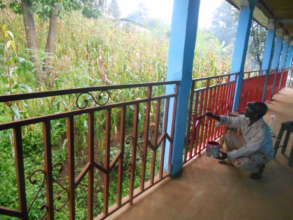 Red paint being used for final painting