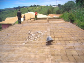 Bricklayer finishing the last class decking block.