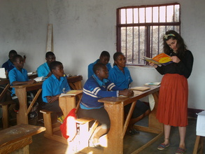 Hannah our volunteer teaching English to the OVCs