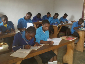 OVCs busy taking English lessons in thier Class