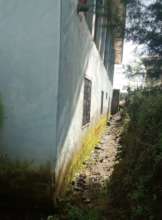 BACK PART NEEDING A STONE WALL TO PROTECT RAIN