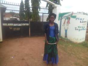 Lois outside Malaika Daycare Center