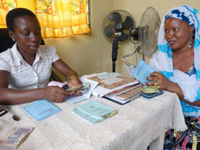Kpone loan client Aishye (r) with our intern, Mary
