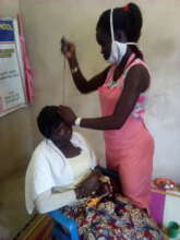 Hair dresser trainee during a practical