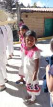 A girl in typical dress celebrates local languages