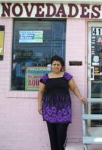 Alejandra in front of HER store